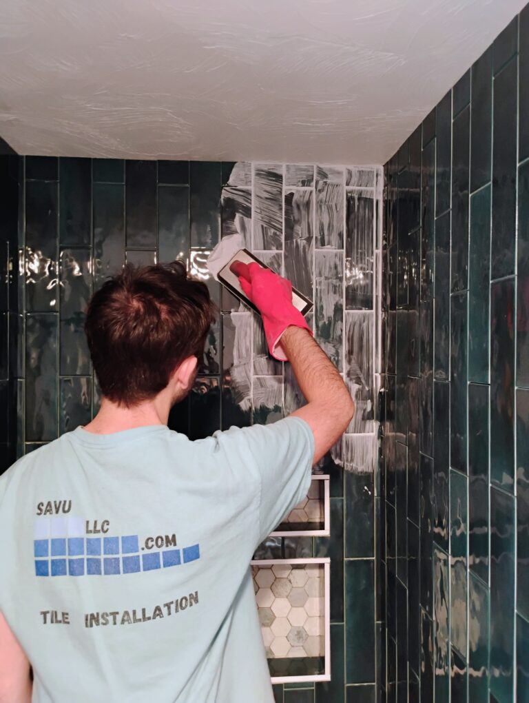 Grouting a green tiled bathroom