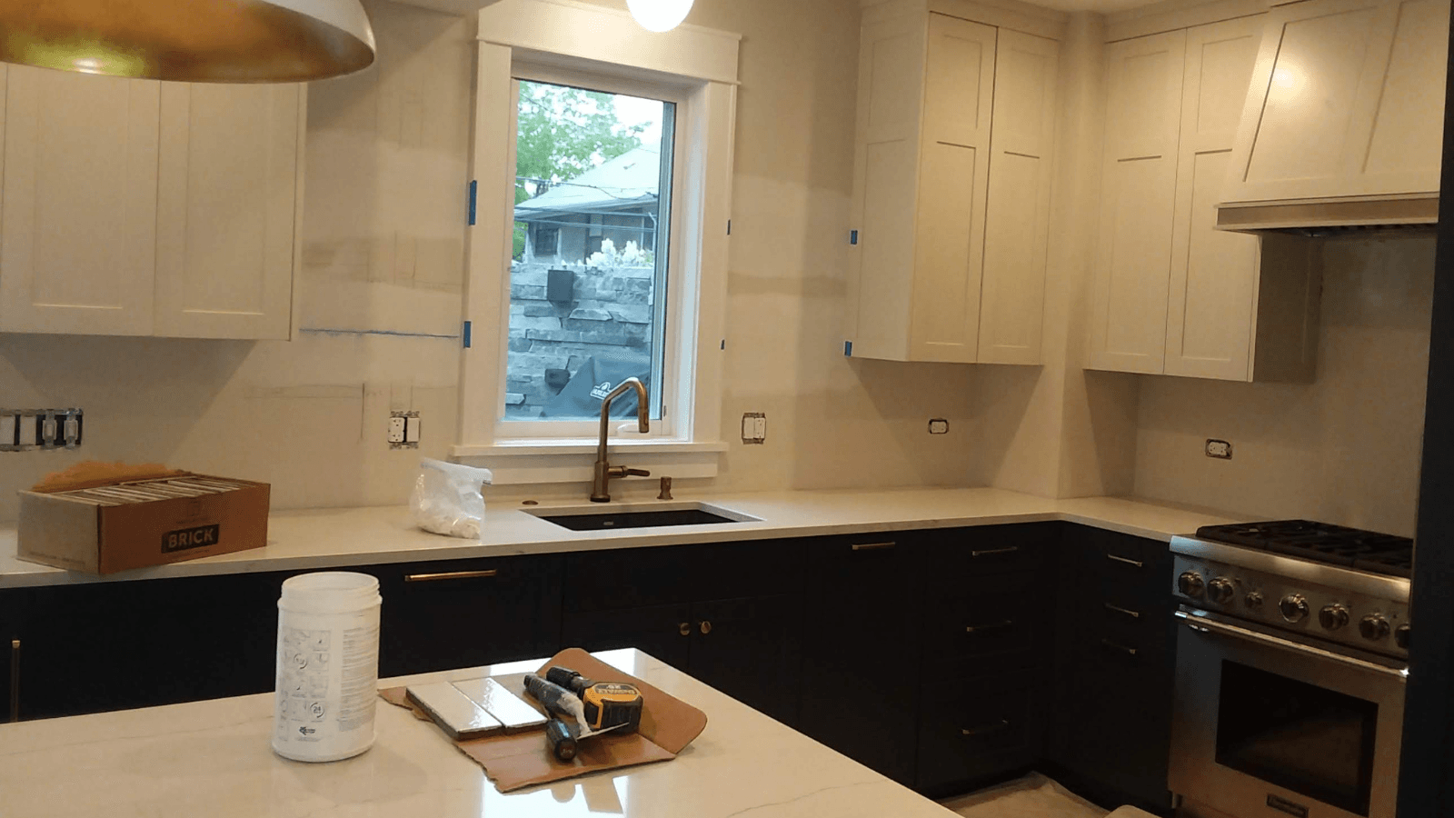 Fireclay tile backsplash before