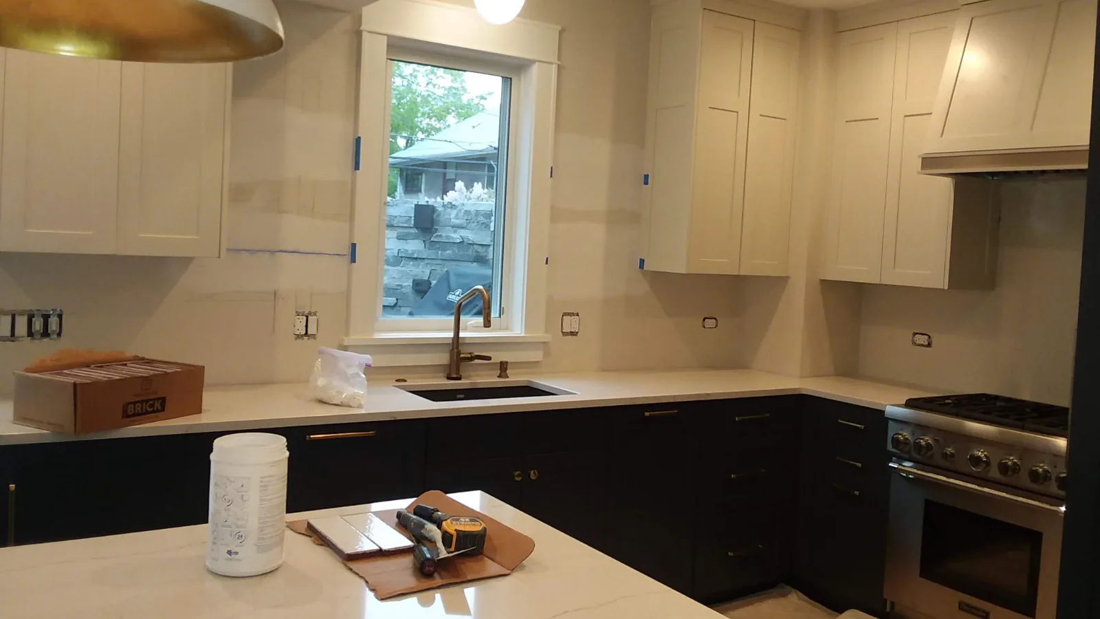 Fireclay tile backsplash before