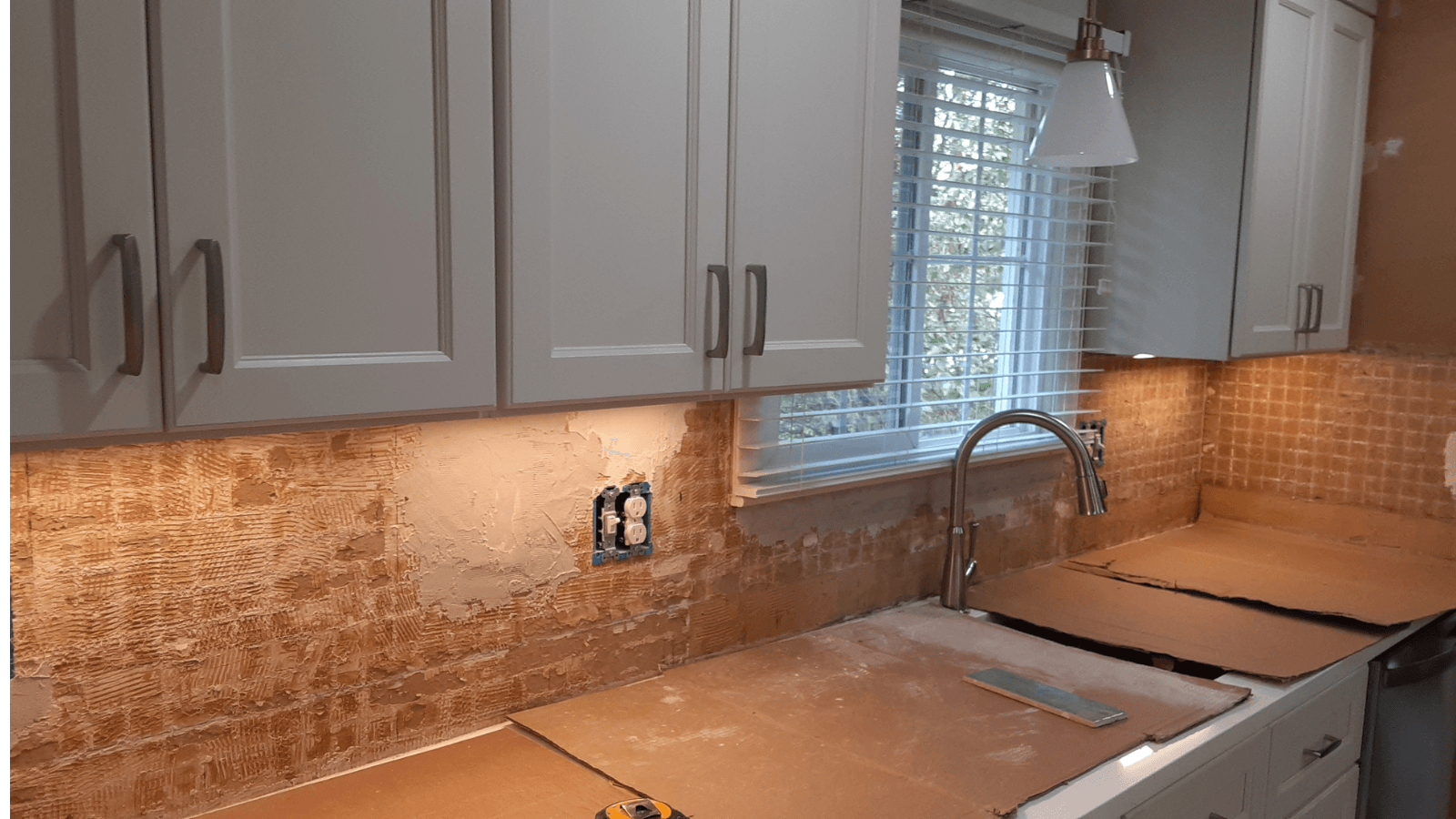 Green subway tile backsplash before