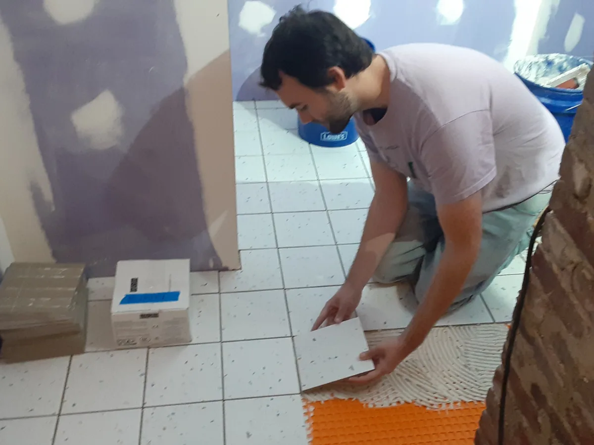 Installing Spanish terrazzo square tile floor