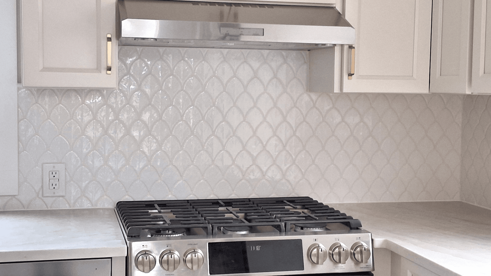 Scallop white porcelain tile backsplash after