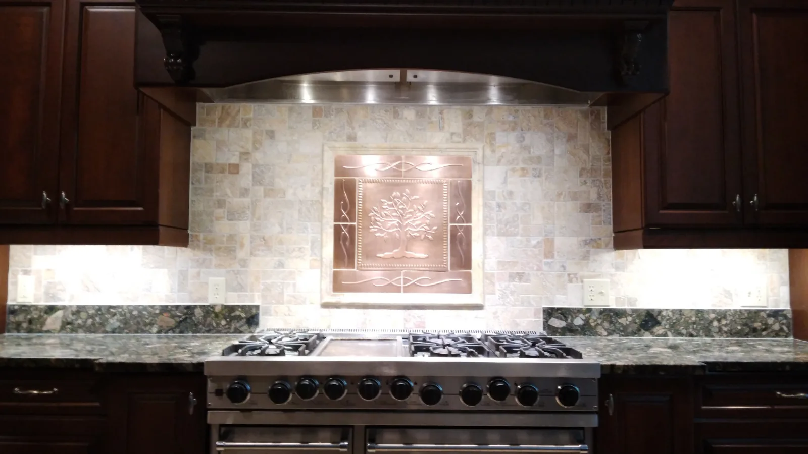Travertine tile backsplash after