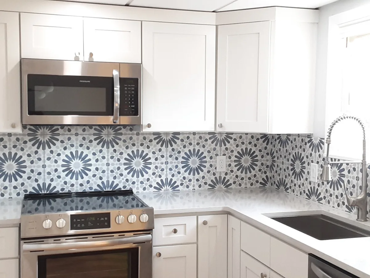 White and blue encaustic tile kitchen backsplash