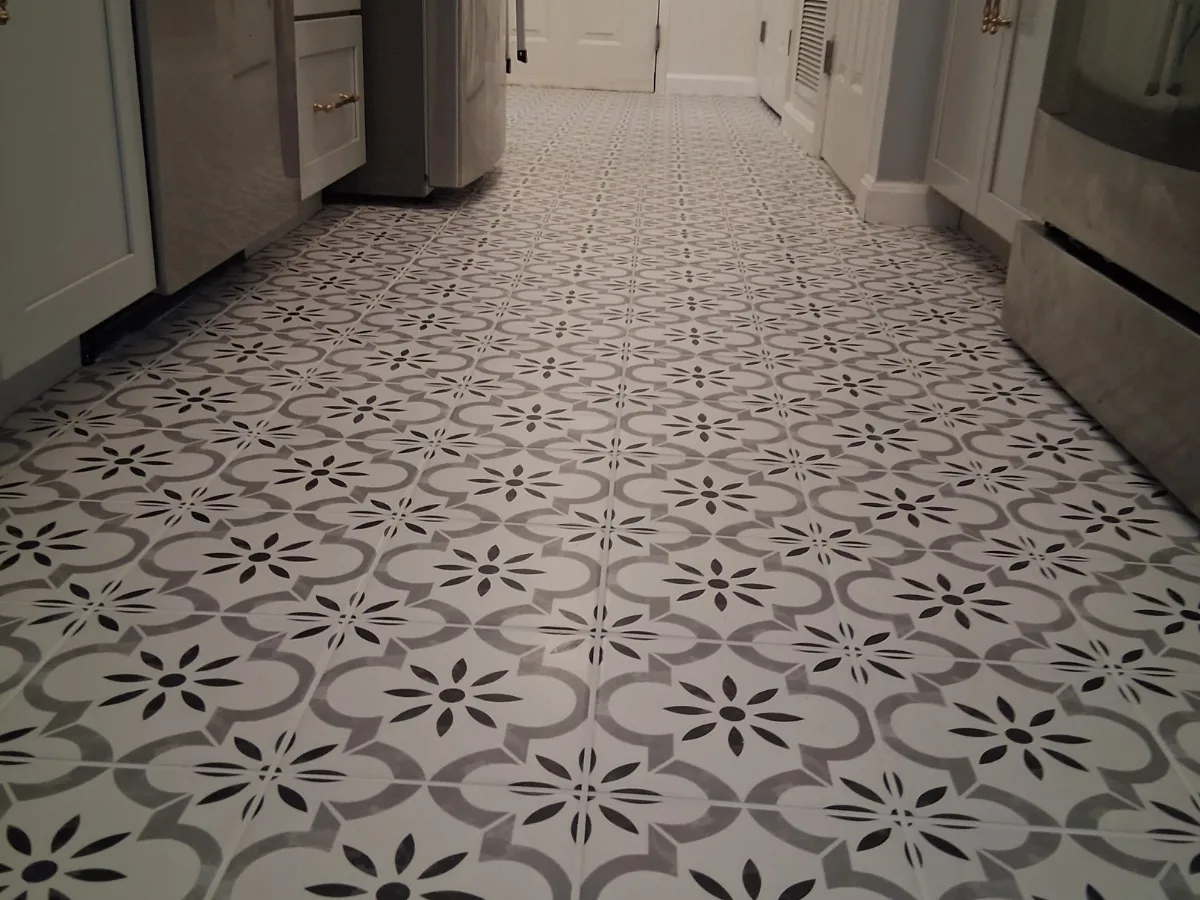 Stunning cement tile kitchen floor with rich geometric patterns and classic character