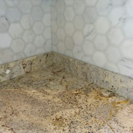 Carrara marble tile backsplash, honeycomb pattern