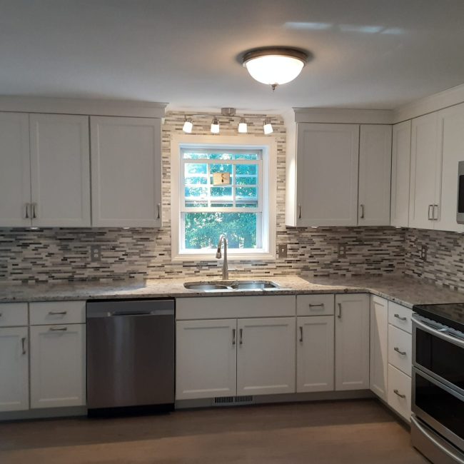 Marble Mosaic Tile Backsplash Marble mosaic tile backsplash with natural veining and soft tones
