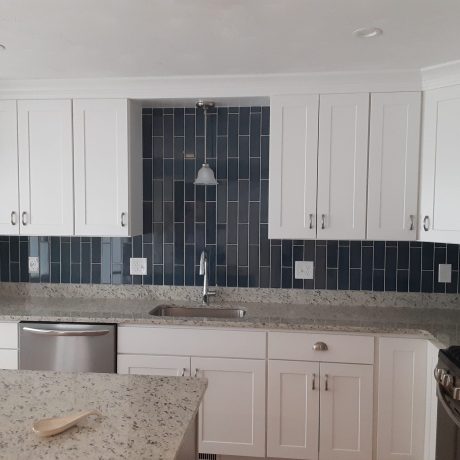 Blue ceramic tile vertical pattern backsplash