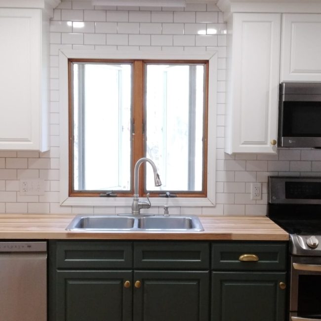 Classic White Subway Tile Backsplash Classic white subway tile backsplash in a bright, clean kitchen design