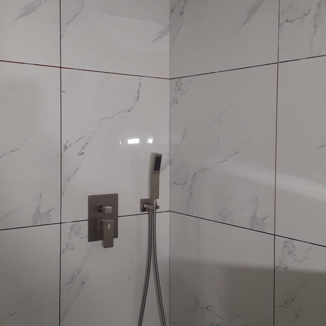 White Large Format Tile Bathroom White large format tile bathroom installation