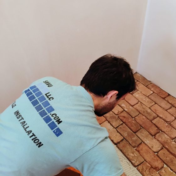 Working on a brick tile floor