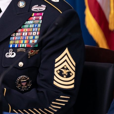 A US Army uniform featuring chevron insignia